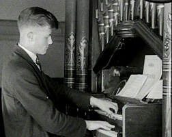 David Pettit at the school organ during Assembly